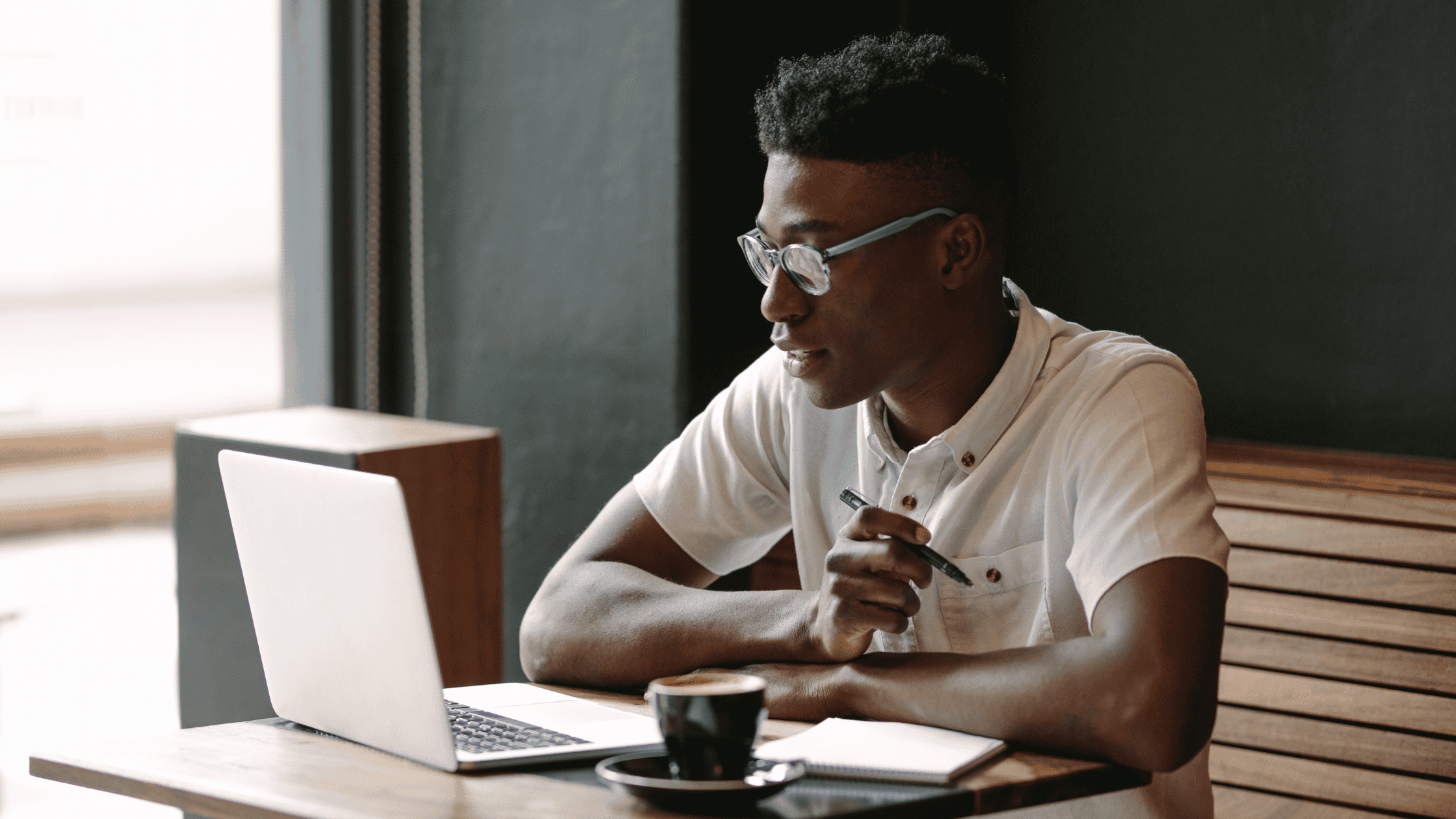 man working in coffee shop