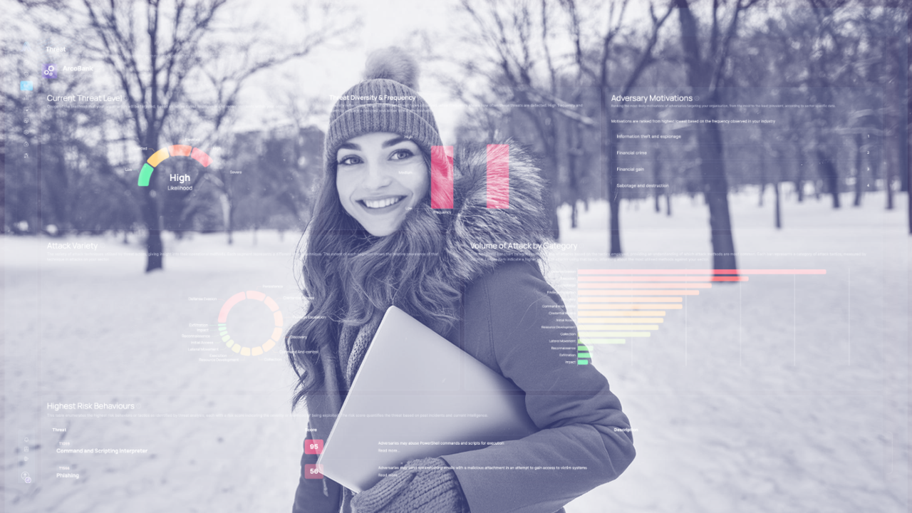 woman holds a laptop in the snow